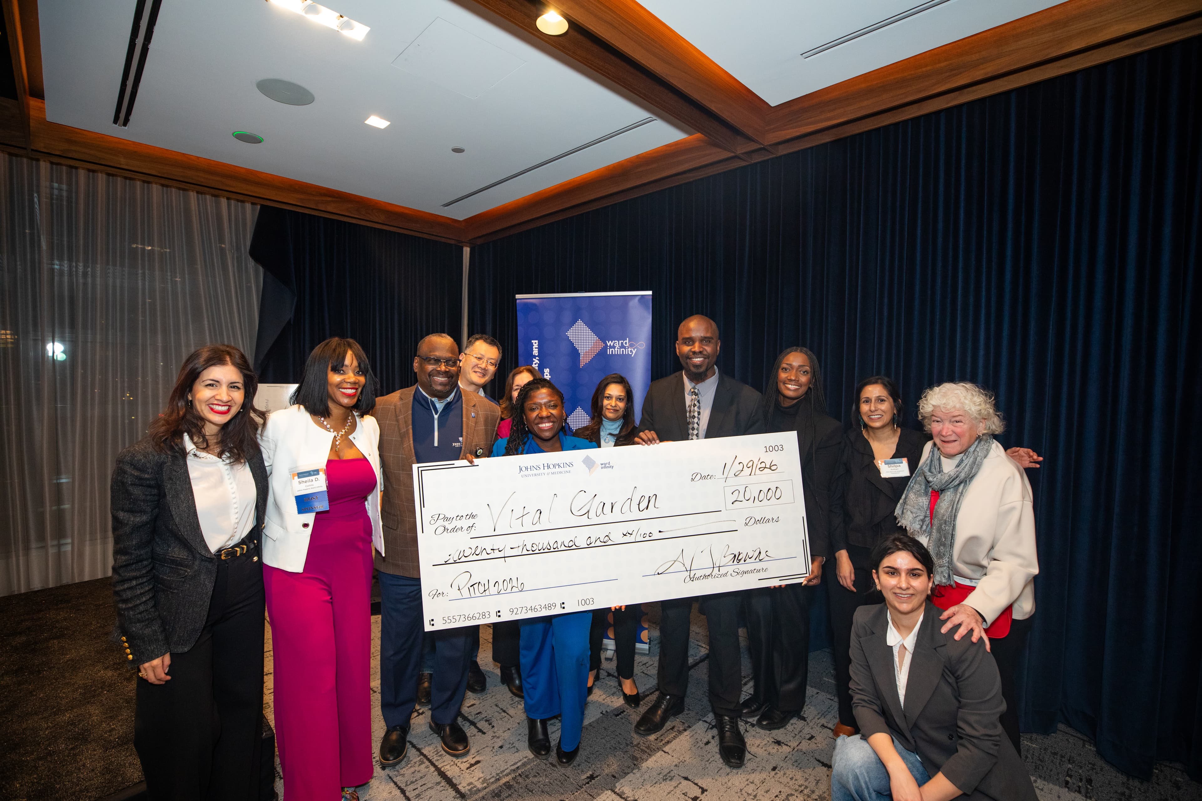 Vital Guardian team receiving $20,000 prize check at Johns Hopkins Ward Infinity