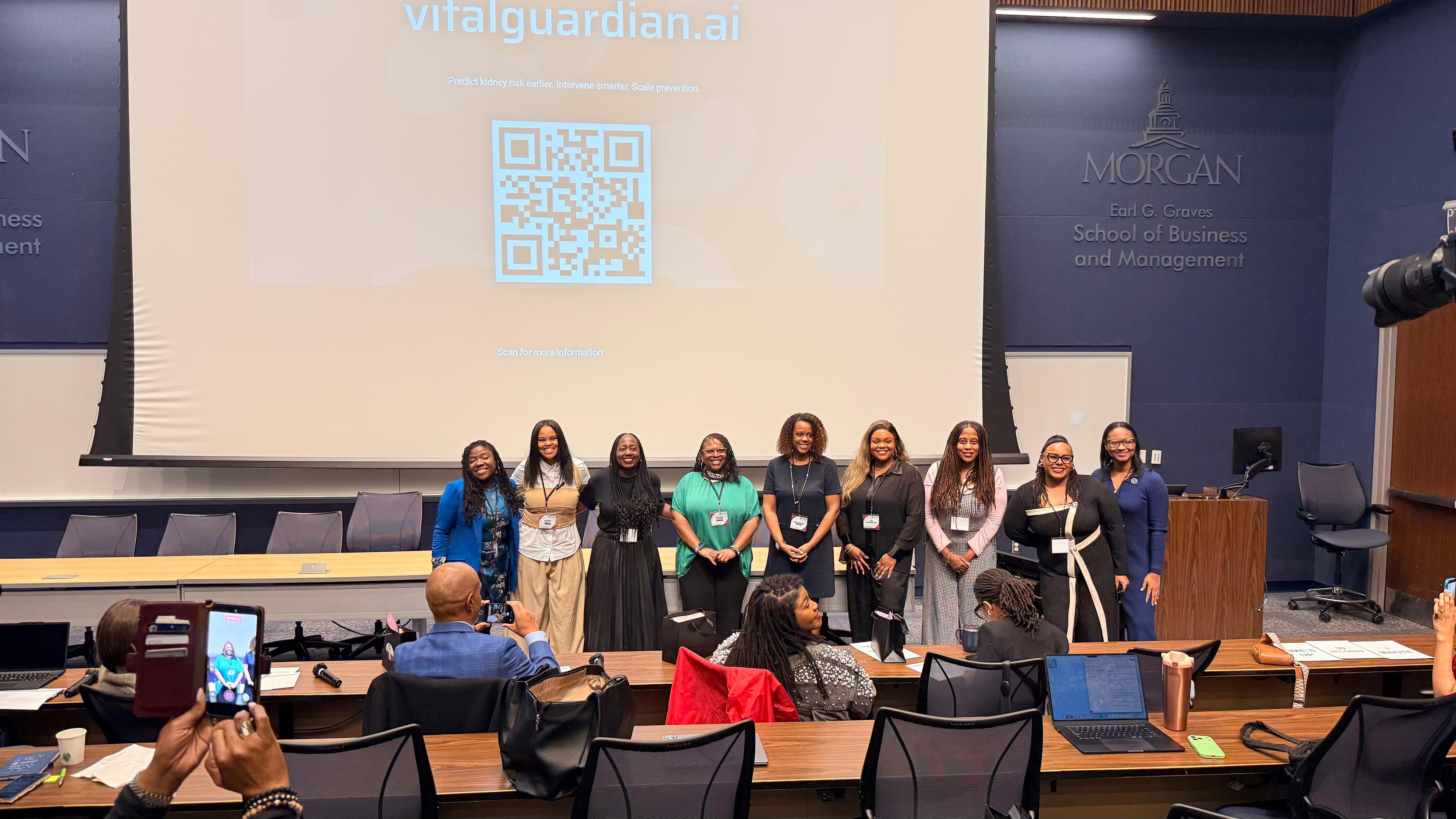 VitalGuardian team presenting at Morgan State University with vitalguardian.ai slide on screen